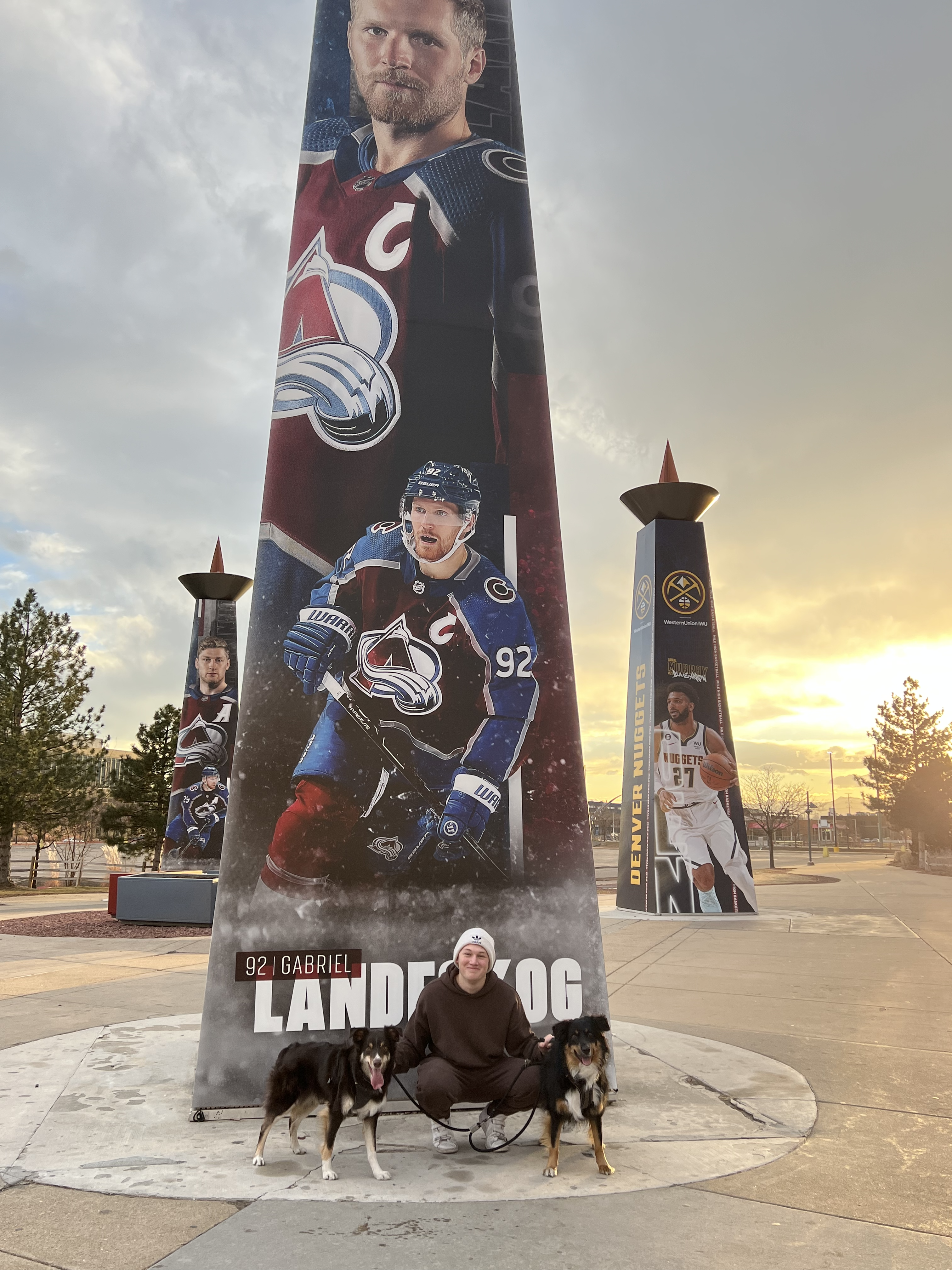 Davis and his dogs in front of Ball Arena